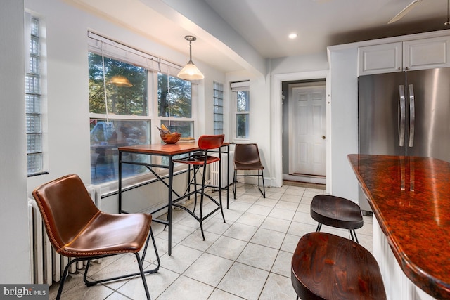 dining area featuring light tile patterned floors