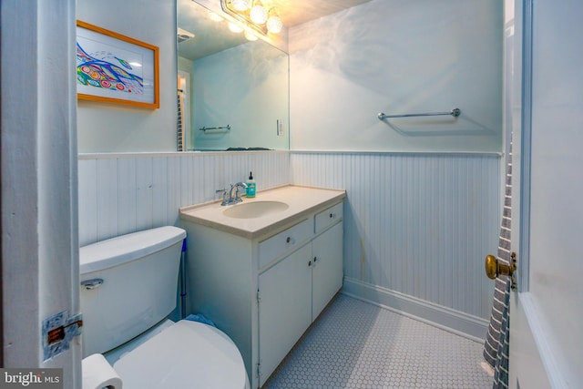 bathroom with toilet and vanity