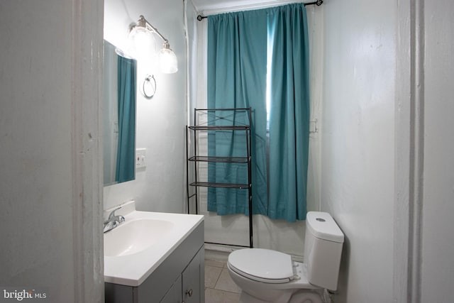 bathroom featuring vanity, toilet, and tile patterned floors