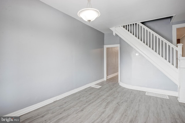 stairway featuring wood-type flooring