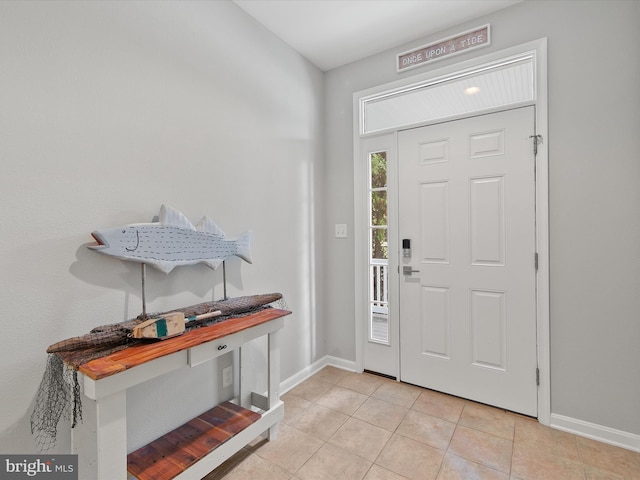 entryway with light tile patterned floors