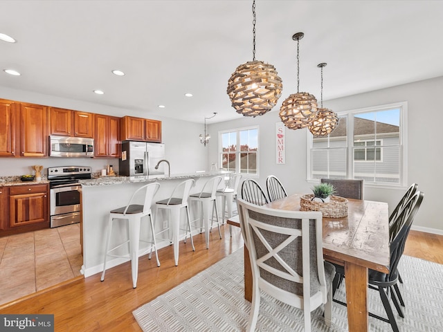 dining room featuring a chandelier and light hardwood / wood-style floors