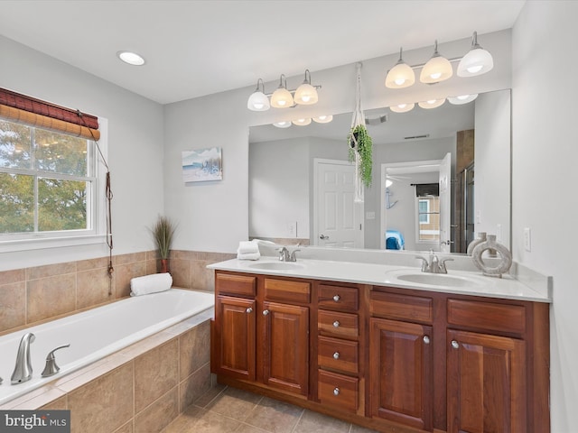 bathroom with vanity, plus walk in shower, and tile patterned floors