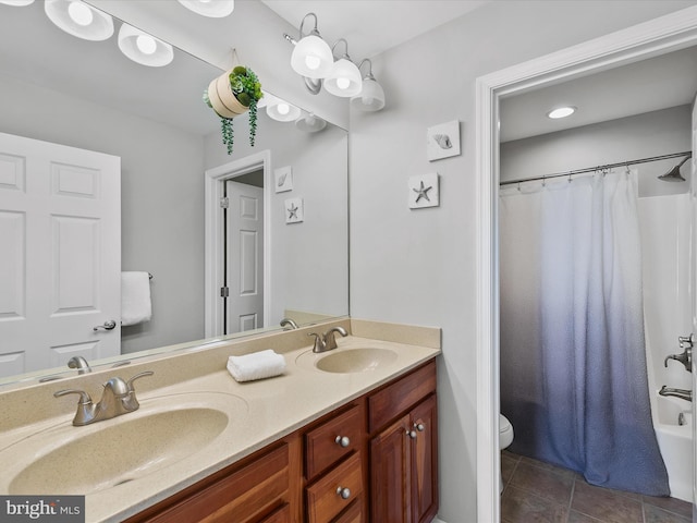 full bathroom featuring vanity, toilet, tile patterned floors, and shower / tub combo