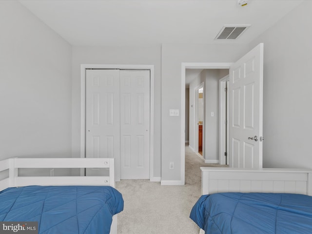 bedroom with a closet and carpet flooring