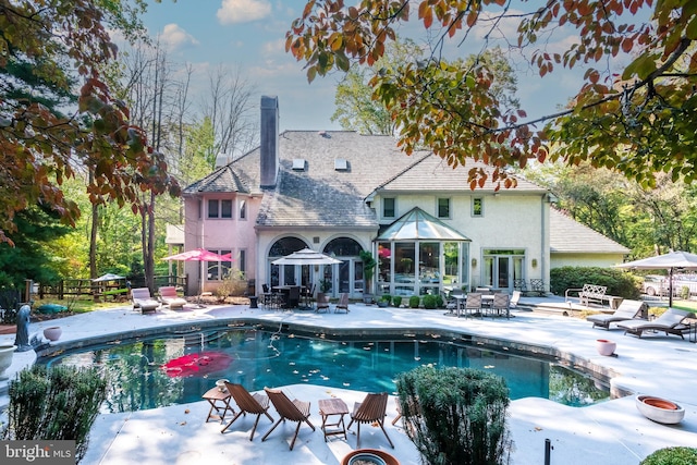 view of pool featuring a patio