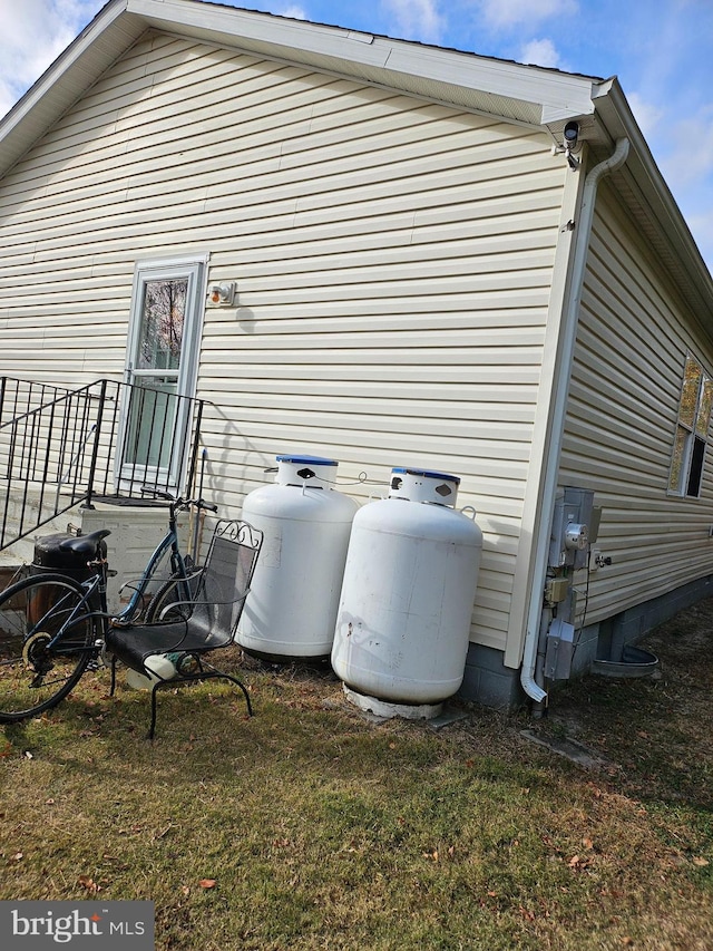 view of side of home featuring a lawn