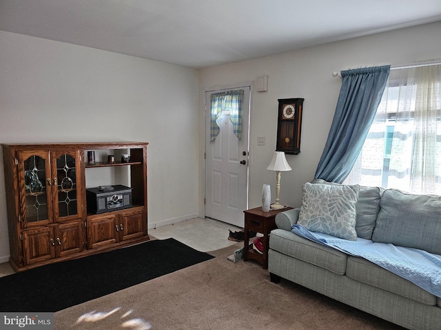 living room featuring light carpet