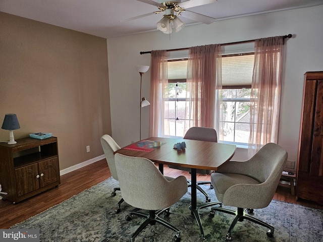 dining area with dark hardwood / wood-style floors and ceiling fan