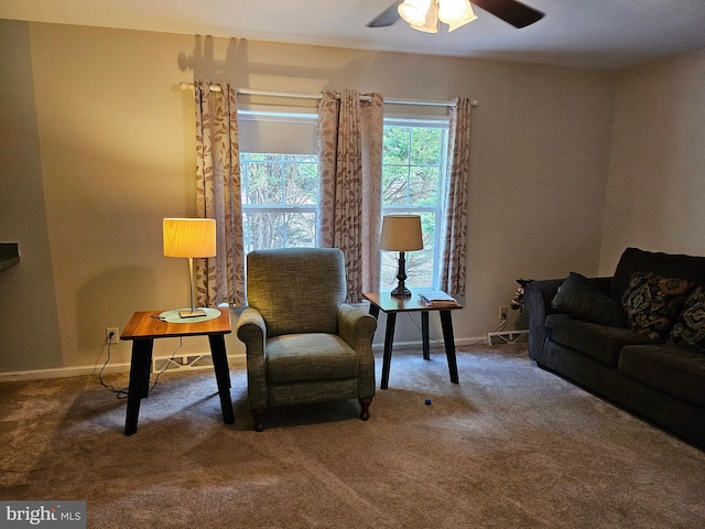 sitting room with carpet and ceiling fan