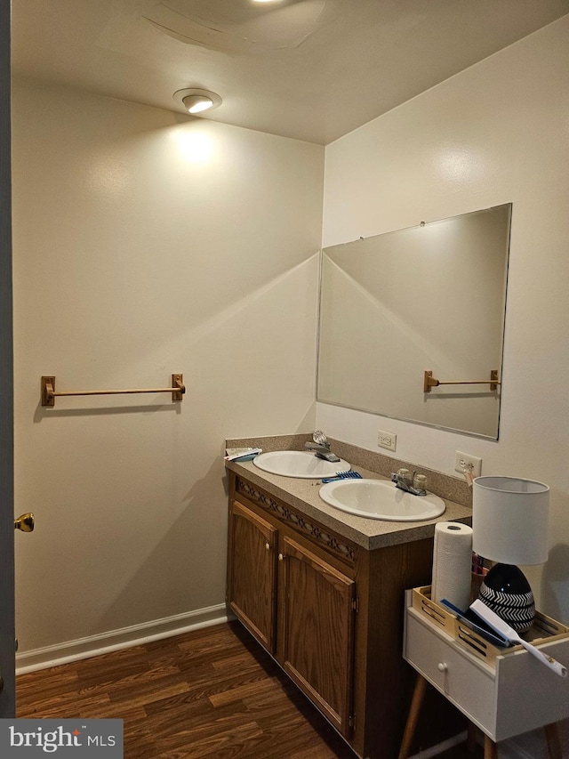 bathroom featuring vanity and hardwood / wood-style flooring