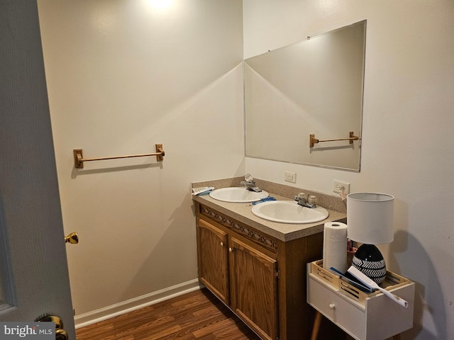 bathroom featuring vanity and wood-type flooring