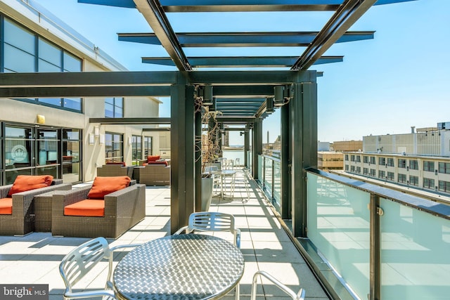 exterior space with an outdoor hangout area and a balcony