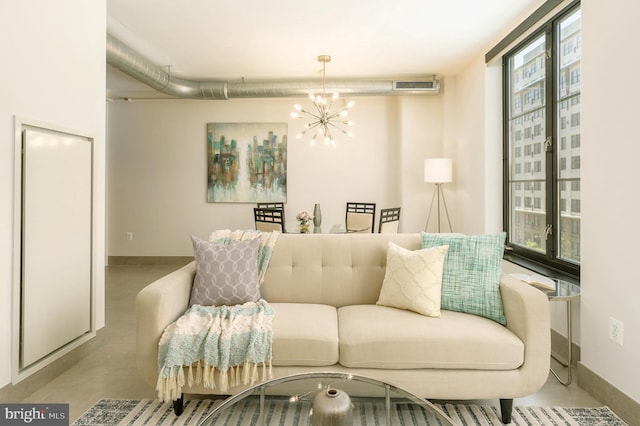 living room with an inviting chandelier