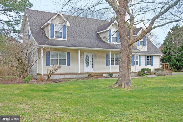 cape cod home with a front yard