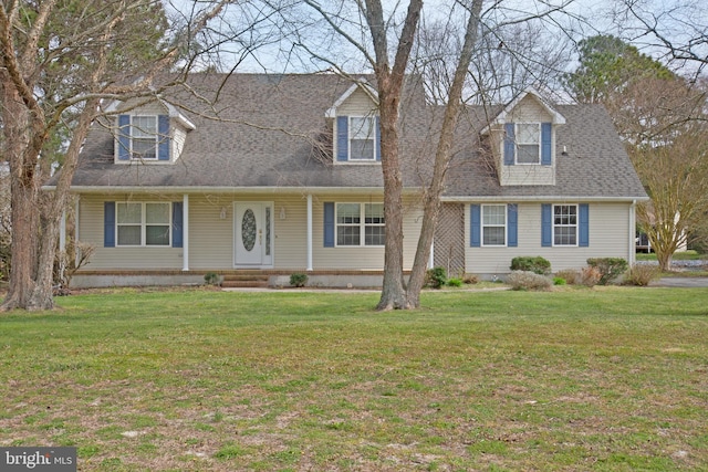 cape cod house featuring a front lawn