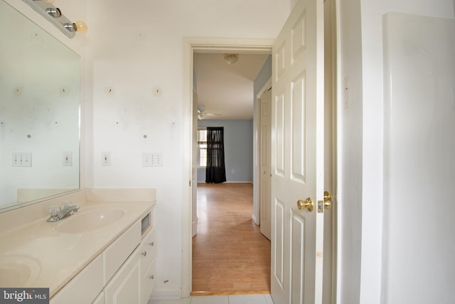 bathroom with vanity, wood-type flooring, and ceiling fan