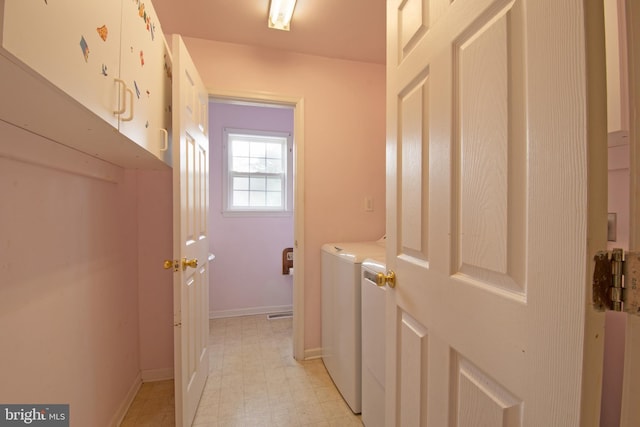 606 Saint Andrews Ct, Dagsboro, DE 19939 - laundry room featuring light floors, cabinet space, baseboards, and independent washer and dryer