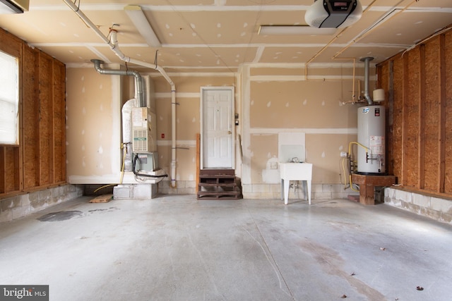 garage with a garage door opener and water heater