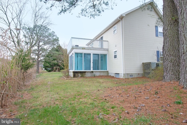 606 Saint Andrews Ct, Dagsboro, DE 19939 - back of property with a balcony and a yard