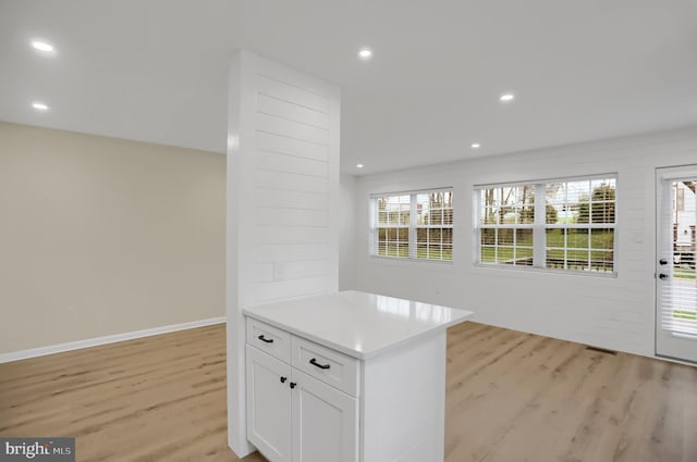 kitchen with white cabinetry and light wood-type flooring