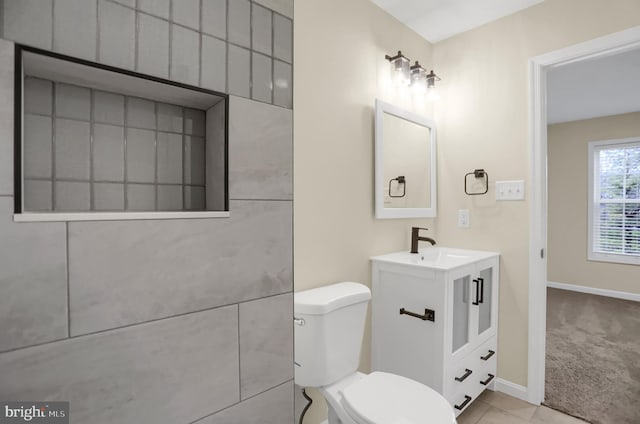 bathroom with toilet and vanity