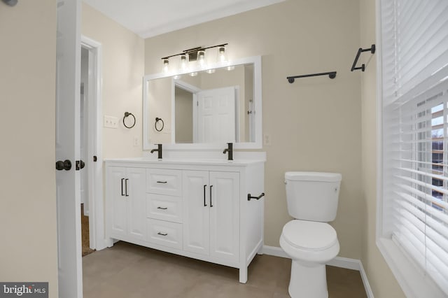 bathroom featuring toilet and vanity