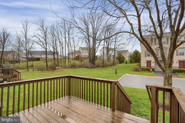 wooden deck with a yard