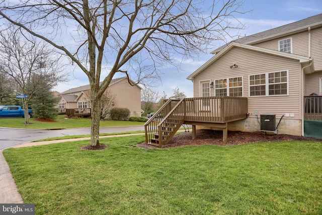 view of yard with cooling unit and a wooden deck