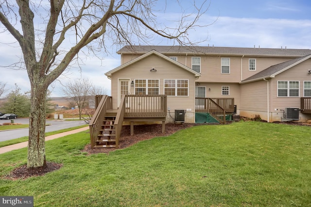 back of property featuring central AC, a yard, and a deck