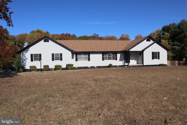 ranch-style house featuring a front lawn