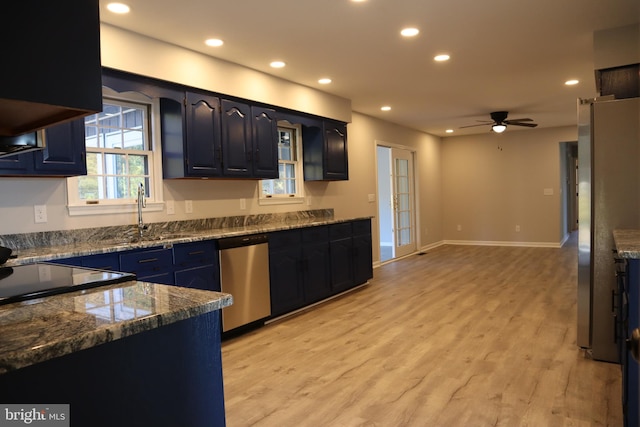 kitchen featuring light wood-type flooring, ceiling fan, appliances with stainless steel finishes, and sink