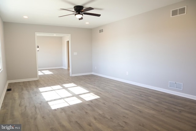 empty room featuring ceiling fan and hardwood / wood-style flooring