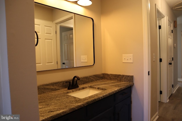 bathroom featuring vanity and hardwood / wood-style floors