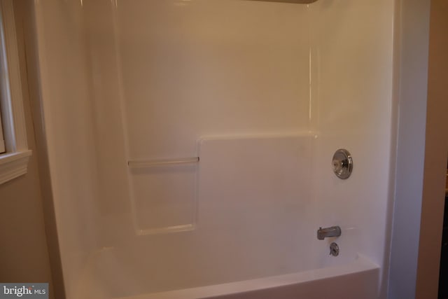 bathroom with shower / bathing tub combination