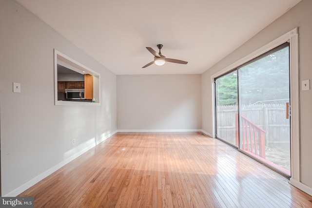 empty room featuring light hardwood / wood-style floors and ceiling fan