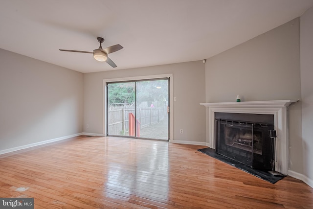 unfurnished living room featuring light wood-type flooring and ceiling fan