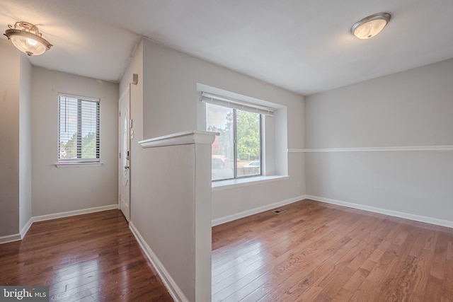 spare room with hardwood / wood-style flooring