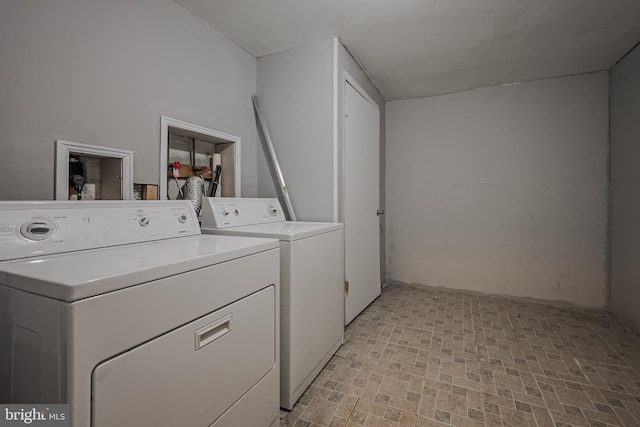 laundry area featuring washing machine and clothes dryer