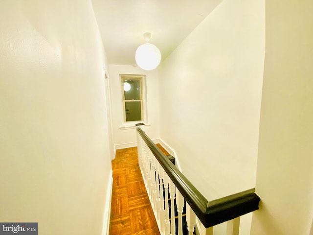 hallway featuring dark parquet floors