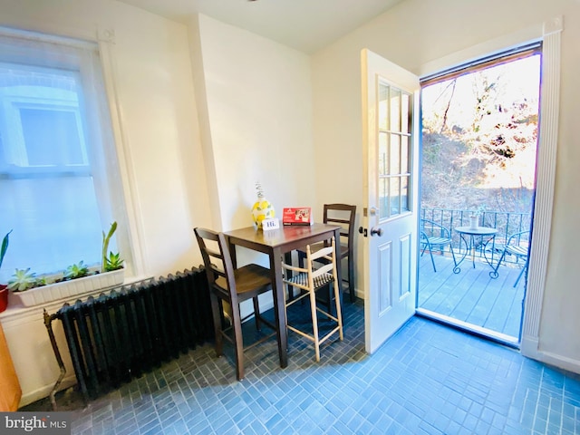 dining room featuring radiator heating unit