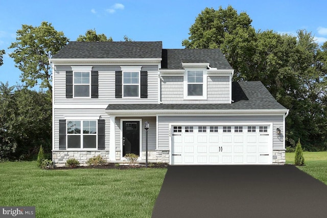 view of front of home with a front lawn and a garage