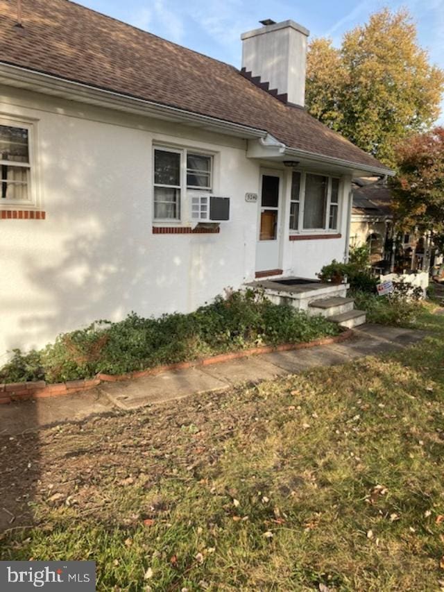 view of front of property featuring cooling unit