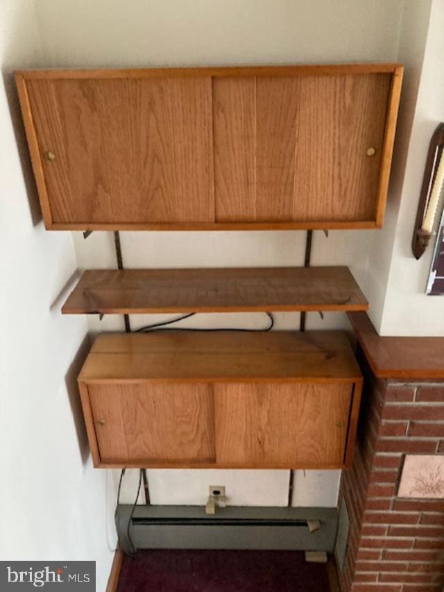 room details featuring a baseboard heating unit