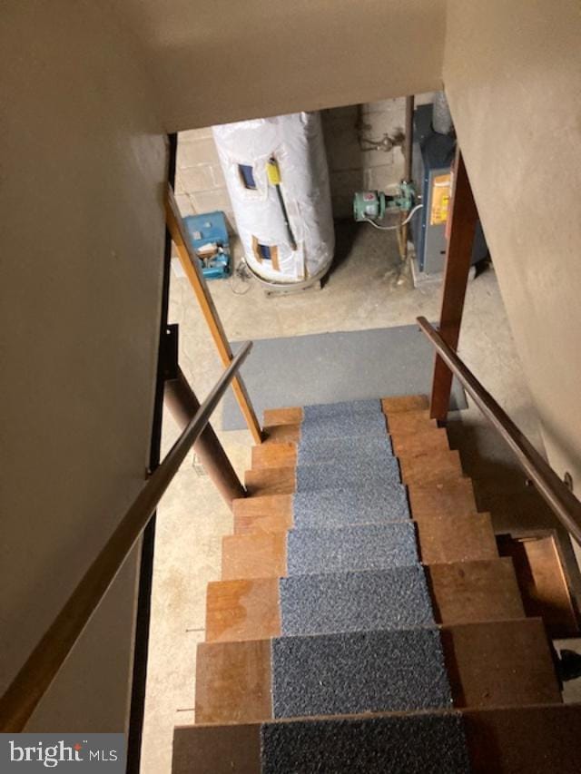 stairway featuring water heater