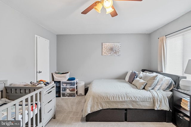 carpeted bedroom featuring ceiling fan