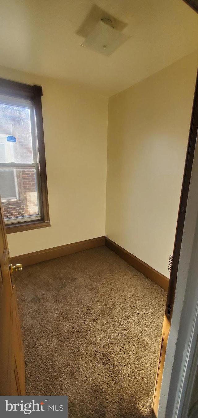 empty room with carpet flooring