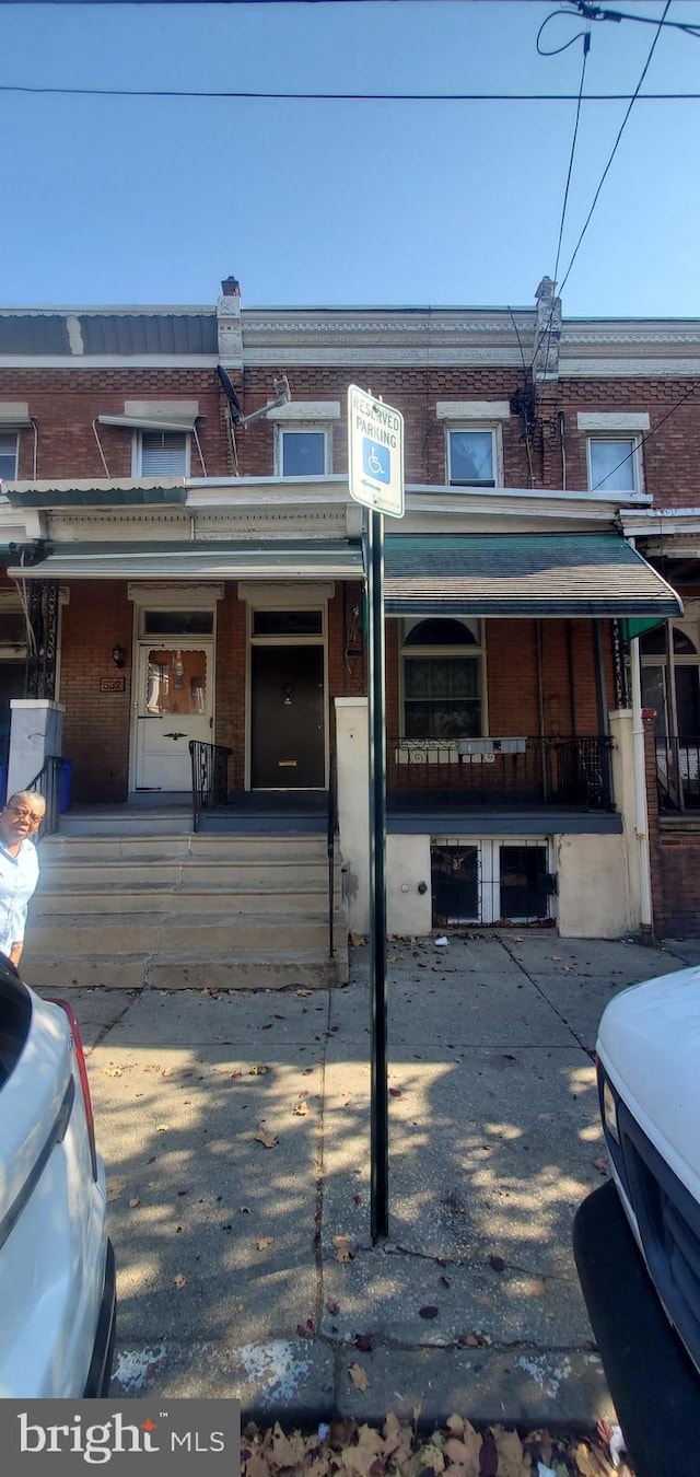 view of property featuring covered porch