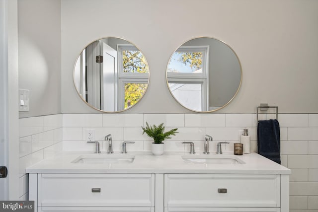 bathroom with tile walls and vanity