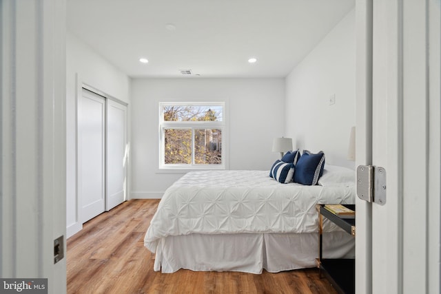 bedroom with wood-type flooring